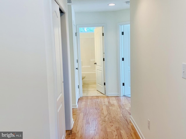 corridor featuring light hardwood / wood-style flooring