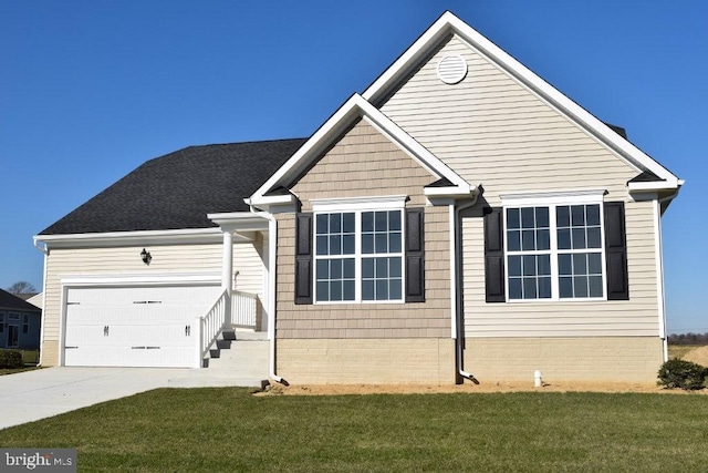 view of front of property featuring a front yard and a garage