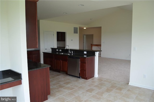 kitchen featuring sink, stainless steel dishwasher, and vaulted ceiling