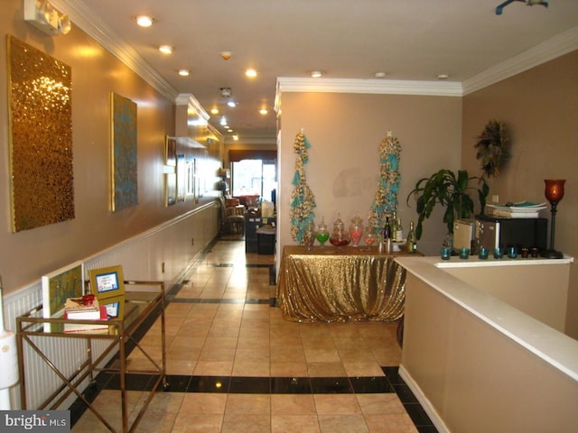 corridor with tile patterned flooring and ornamental molding