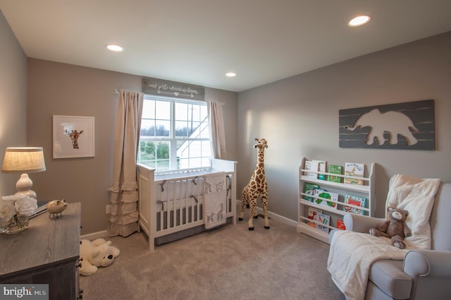 bedroom featuring light colored carpet