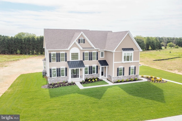 view of front of house featuring central AC unit and a front yard