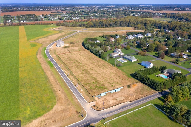 birds eye view of property featuring a rural view