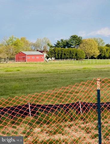 view of yard with a rural view