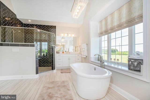 bathroom with vanity, plus walk in shower, and vaulted ceiling