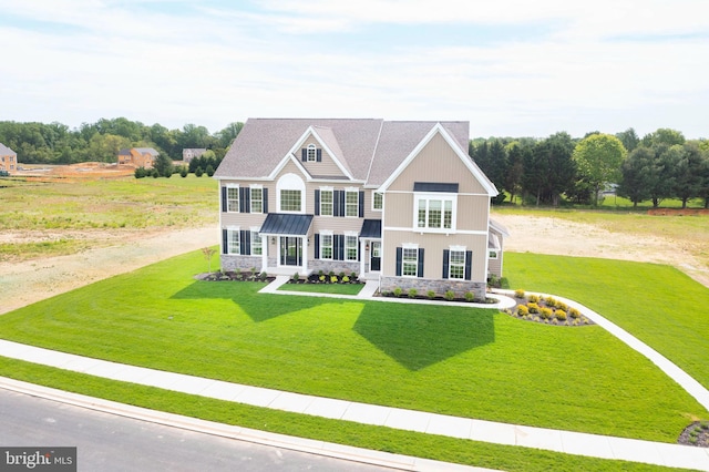 view of front of home featuring a front yard