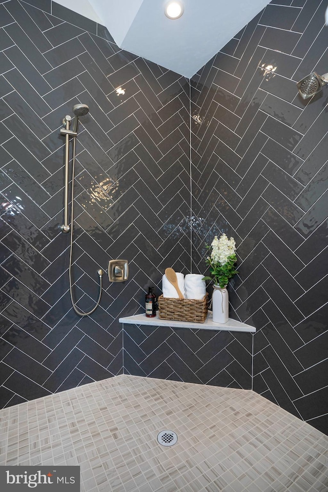 bathroom with tiled shower