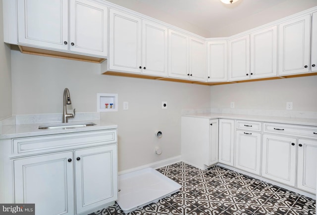 washroom featuring sink, cabinets, washer hookup, electric dryer hookup, and dark tile patterned floors