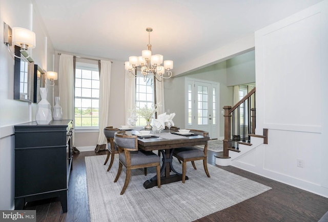 dining room with a chandelier and dark wood-type flooring