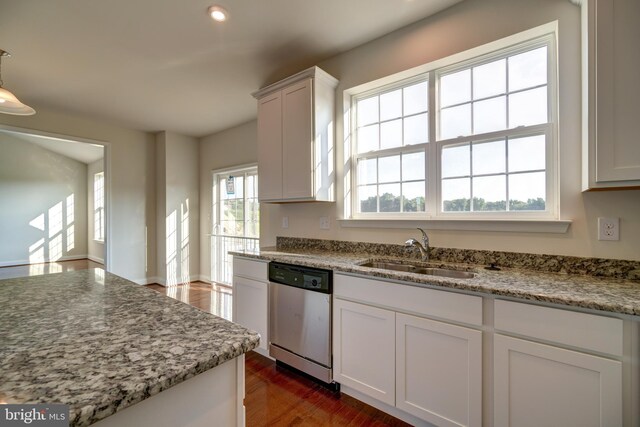 kitchen featuring dark hardwood / wood-style floors, dishwasher, white cabinetry, light stone countertops, and sink