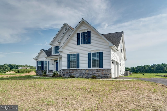 view of front facade with a garage and a front lawn