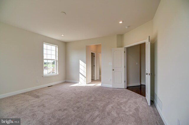 unfurnished bedroom with carpet flooring