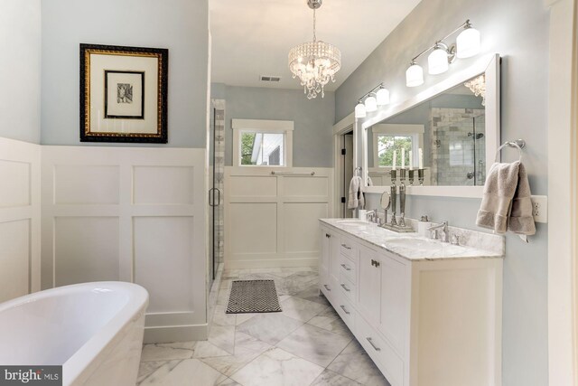 3621 Edgemont St, Edgewater, MD 21037 - full bathroom with a shower stall, marble finish flooring, a decorative wall, double vanity, and a freestanding tub