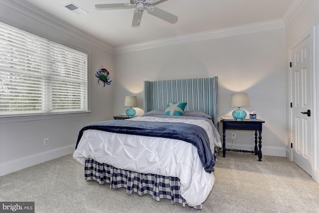 carpeted bedroom featuring ceiling fan and ornamental molding