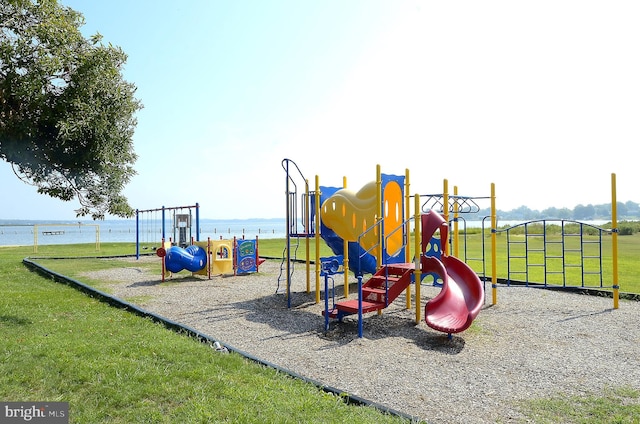 view of jungle gym with a water view