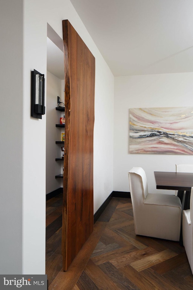 sitting room with dark parquet floors