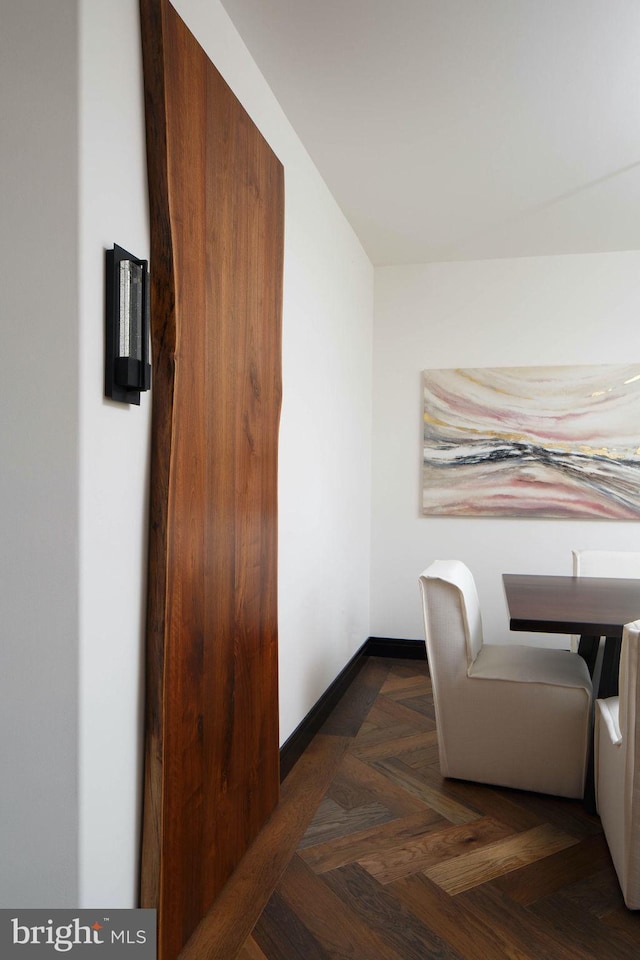 interior space featuring dark parquet flooring