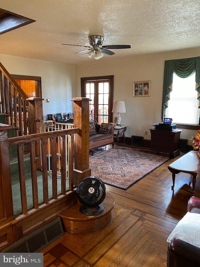 1457 W Landis Ave, Vineland, NJ 08360 - living room with ceiling fan, wood-type flooring, and a textured ceiling