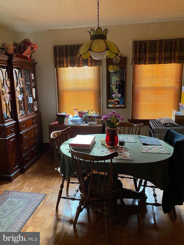 1457 W Landis Ave, Vineland, NJ 08360 - dining room with a textured ceiling and parquet flooring