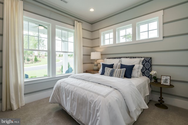 bedroom with light colored carpet