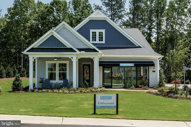 view of front of house featuring a front yard and covered porch