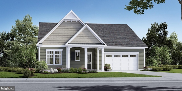 view of front of house featuring a front yard and a garage