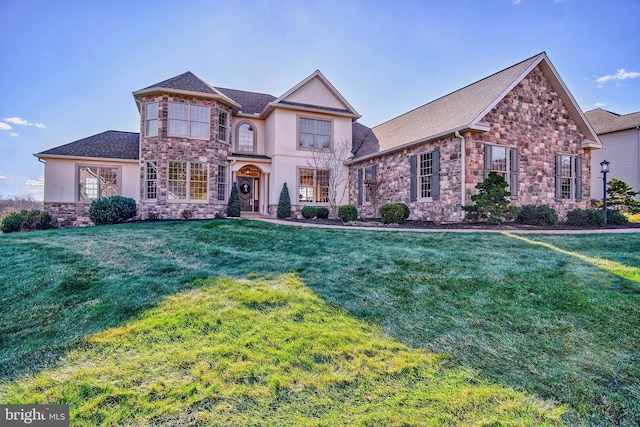 view of front of home with a front yard