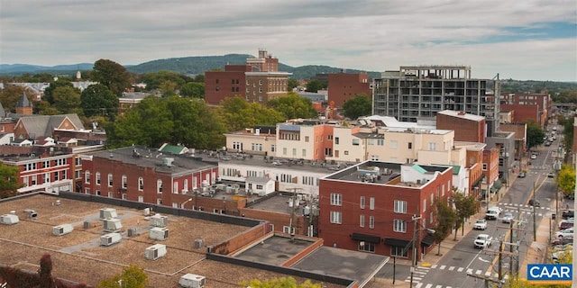 property's view of city featuring a mountain view