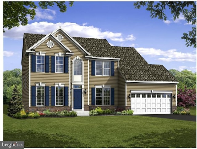 view of front of house featuring a front yard and a garage