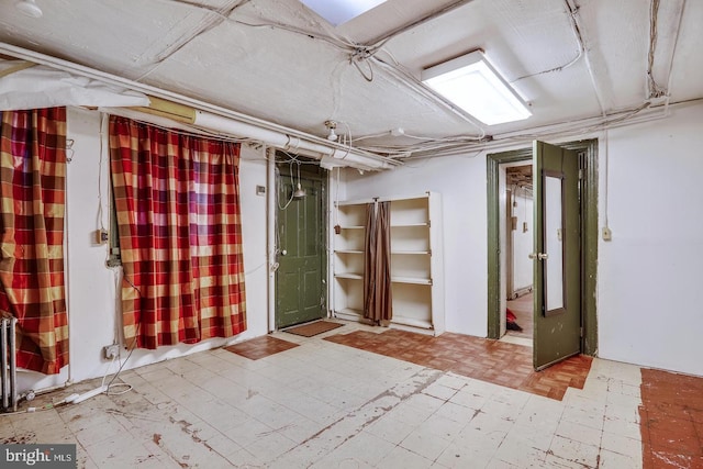 basement featuring light tile floors