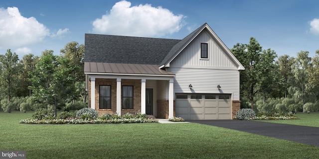 view of front of home with a front lawn and a garage