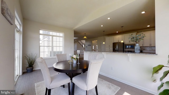 dining area with wood-type flooring