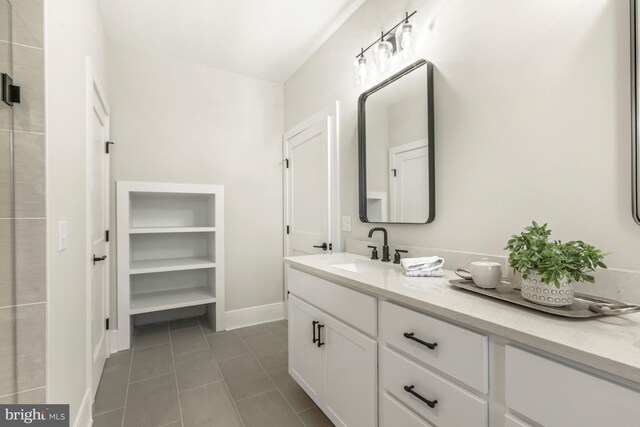 bathroom featuring vanity and tile flooring