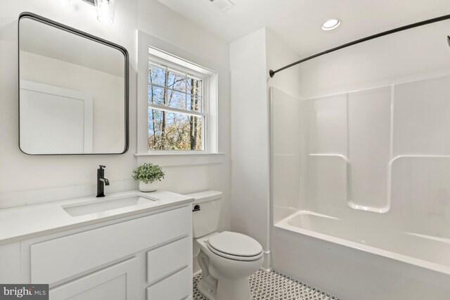 full bathroom featuring shower / bathtub combination, toilet, large vanity, and tile flooring