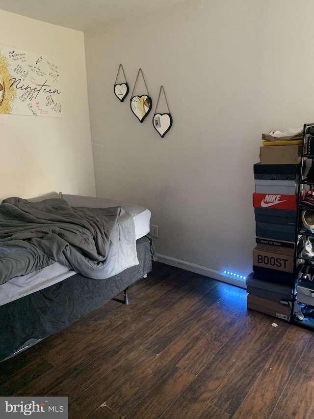 bedroom featuring dark wood-type flooring