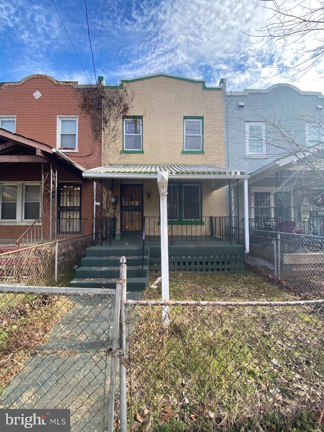 multi unit property featuring a porch