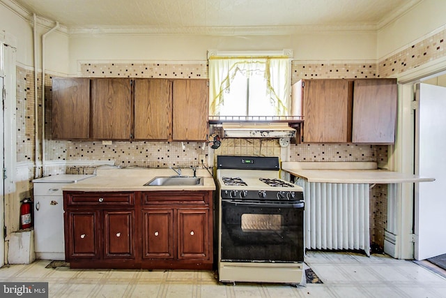 kitchen featuring white range with gas cooktop, light tile flooring, fume extractor, backsplash, and sink