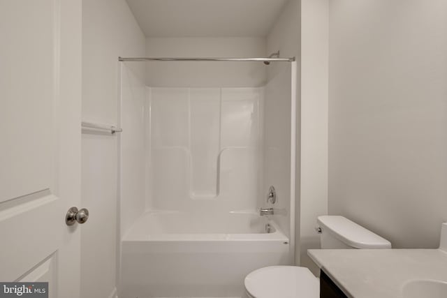 full bathroom featuring toilet, washtub / shower combination, and vanity