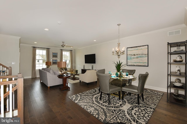 dining space featuring dark hardwood / wood-style flooring, ceiling fan with notable chandelier, and ornamental molding