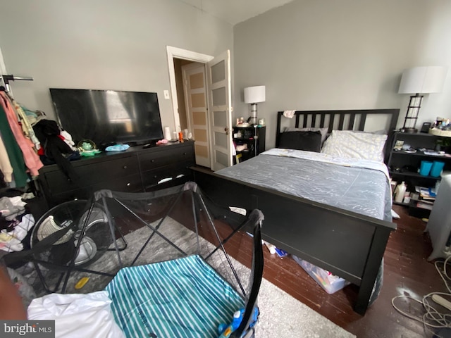 bedroom featuring dark wood-type flooring