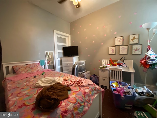 bedroom featuring ceiling fan and lofted ceiling