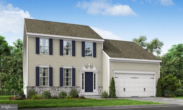 colonial inspired home featuring a front lawn and a garage