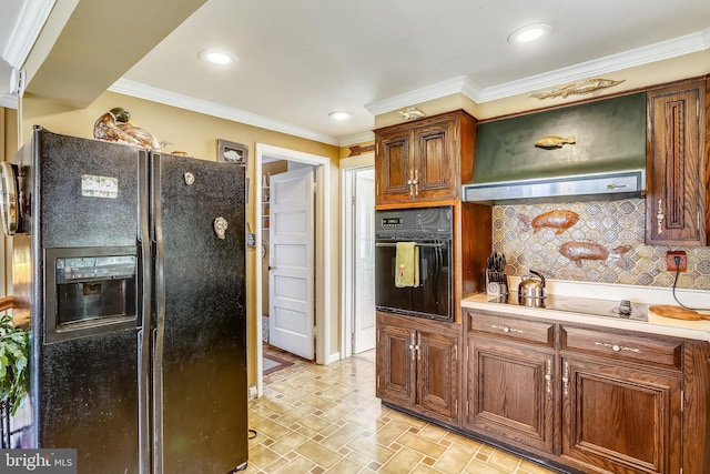 kitchen with light tile floors, crown molding, black appliances, wall chimney range hood, and tasteful backsplash