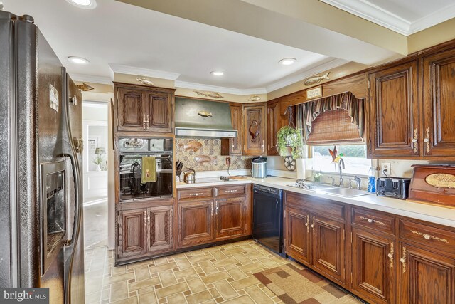 kitchen with tasteful backsplash, light tile floors, black appliances, wall chimney exhaust hood, and sink