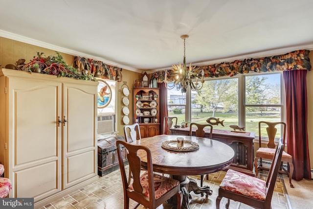 dining room featuring light tile flooring, ornamental molding, and a notable chandelier