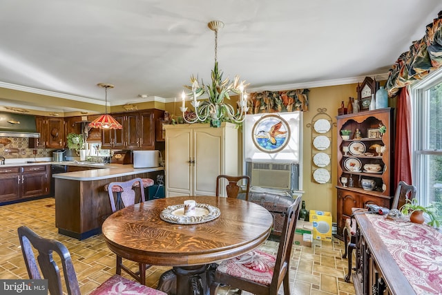 tiled dining room featuring crown molding, sink, and a chandelier