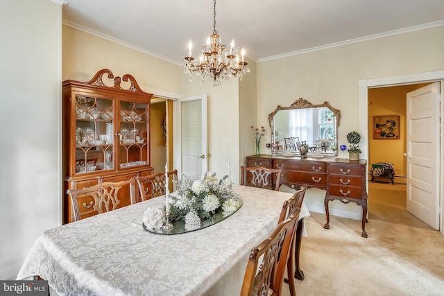 carpeted dining area with a chandelier and ornamental molding