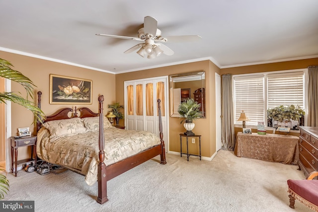 carpeted bedroom featuring ceiling fan and ornamental molding