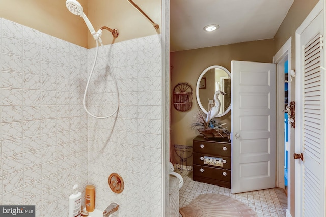 bathroom with toilet and tile floors