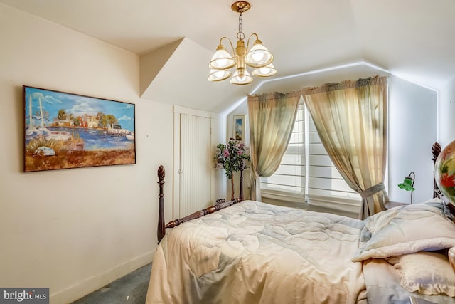 carpeted bedroom featuring a notable chandelier and lofted ceiling